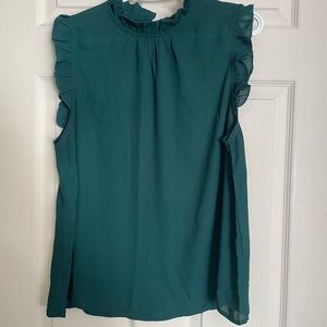 Green sleeveless blouse
